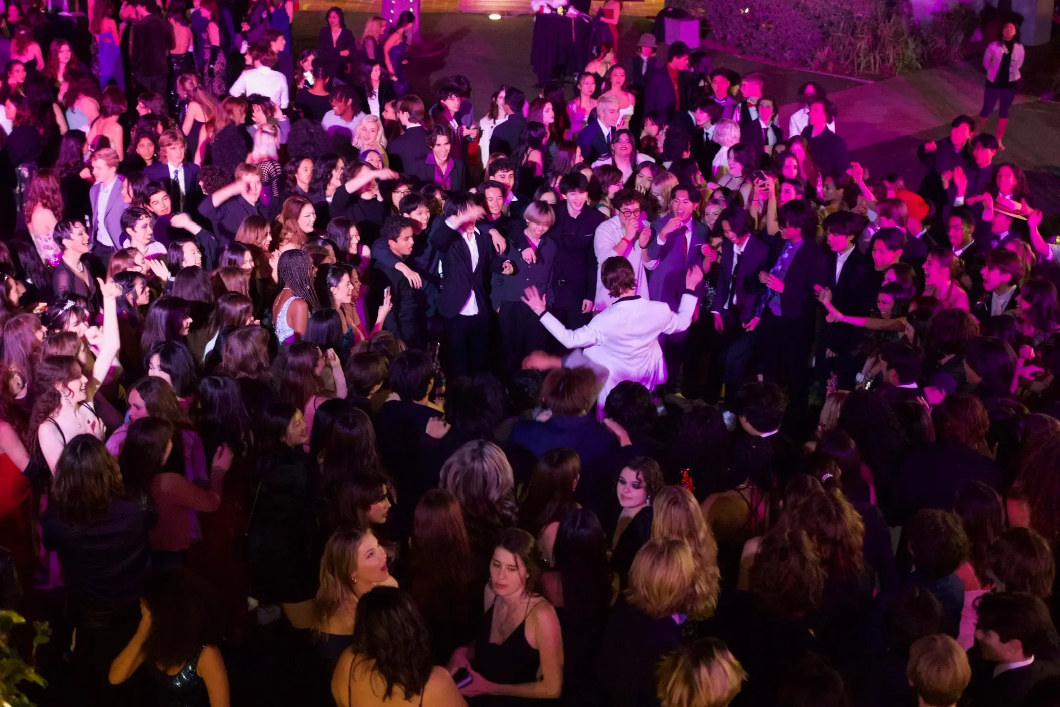 Overhead view of a packed dance floor mid-party